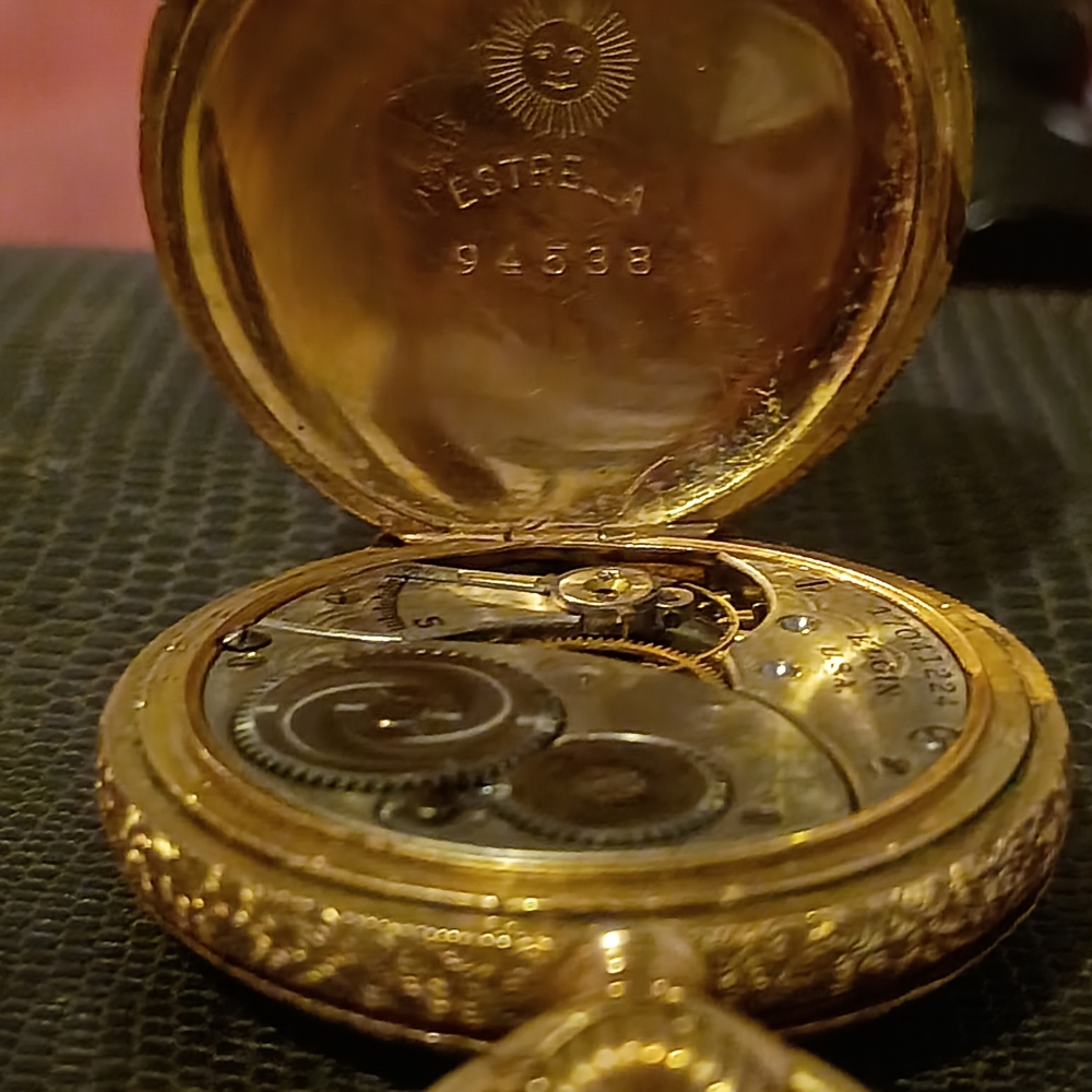 Gold Pocket Watch with Intricate Mechanism